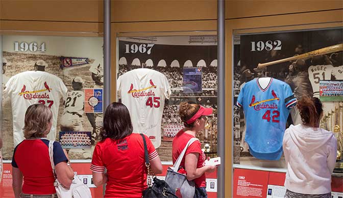 Cardinals fans visit museum exhibits at the Cardinals Hall of Fame Museum in St. Louis, Missouri