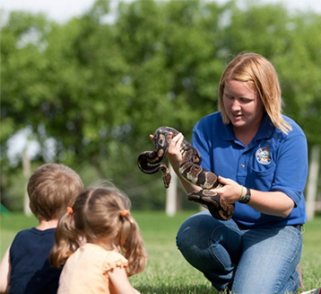 Kids with a snake at the Amarillo Zoo in Amarillo, Texas