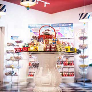 A round glass-topped table displays candies at Sweet Pete’s in Jacksonville, Florida