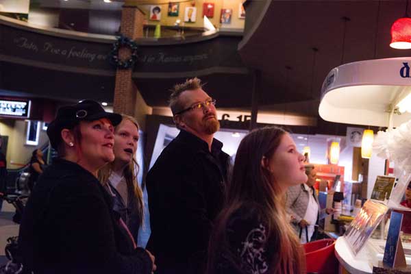 A family chooses food at a concession stand in Lubbock, Texas