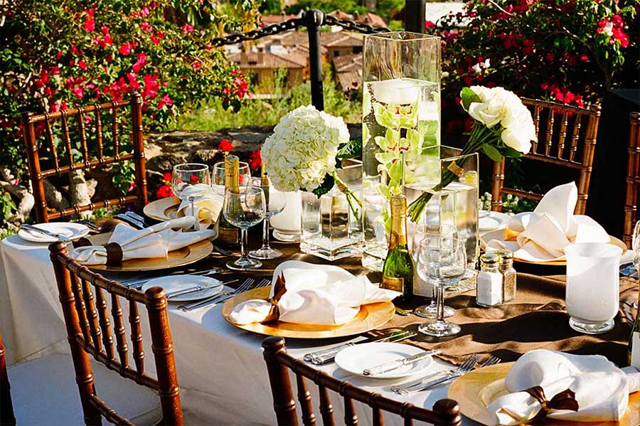 A formally set table on the patio at The Willows Historic Palm Springs Inn