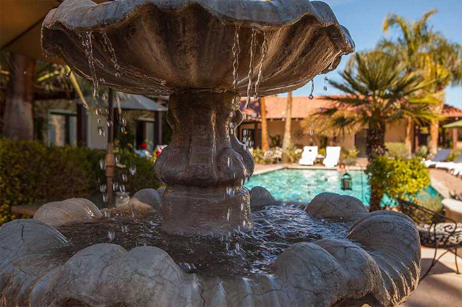 Poolside fountain at La Maison Hotel in Palm Springs, California