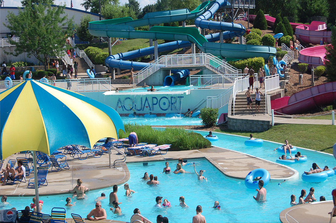 People enjoy the pool and lazy river at Aquaport in Maryland Heights, Missouri