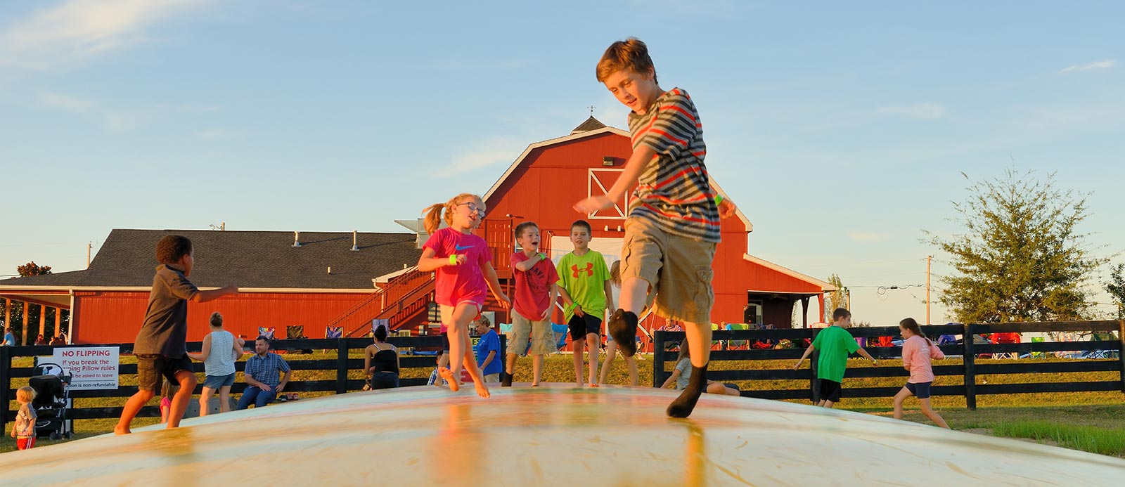 Kids jumping on an inflatable at Chaney’s Dairy Barn in Bowling Green, KY