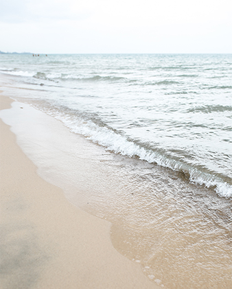 Small waves break on the lakeside shore in Indiana Dunes, Indiana