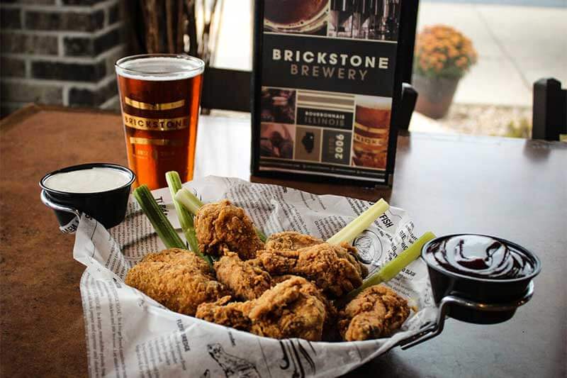 A chicken meal with a glass of beer at Brickstone Brewery in Kankakee, County Illinois