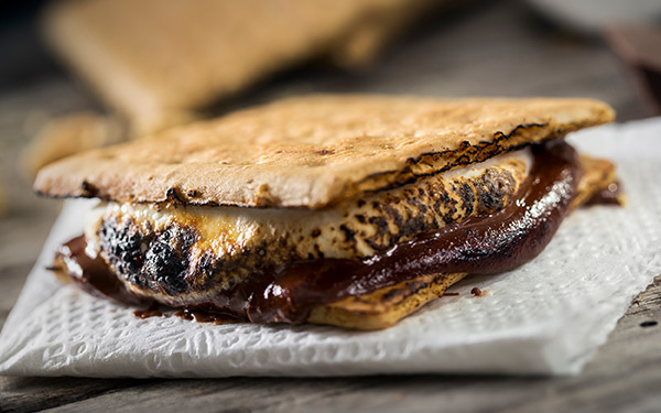 A toasted s'more rests on a white paper towel in Lincoln City, OR