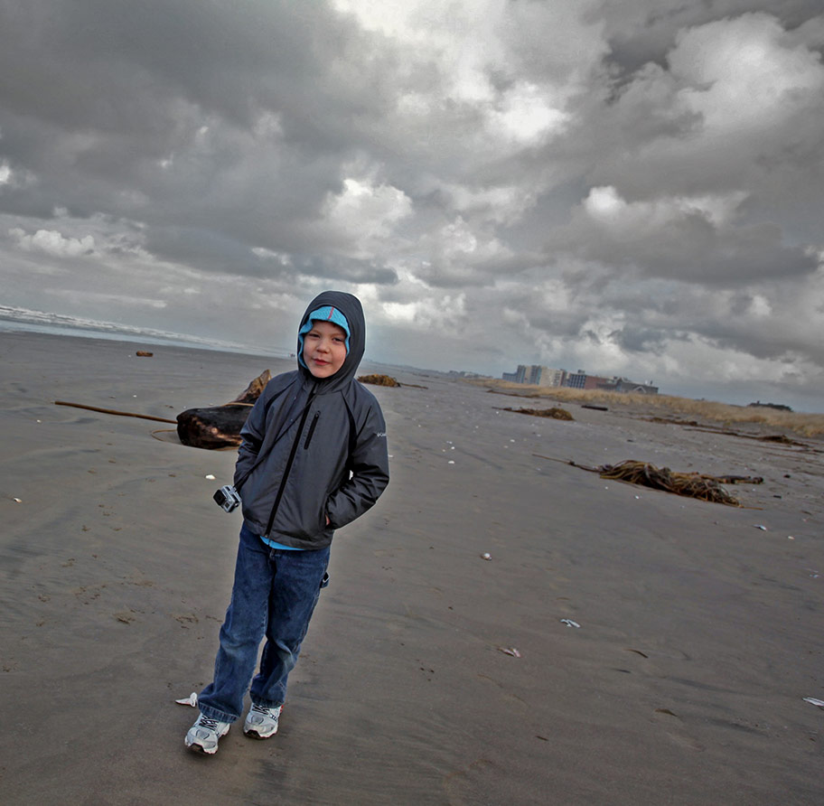 Young boy on the beach in Seaside, Oregon