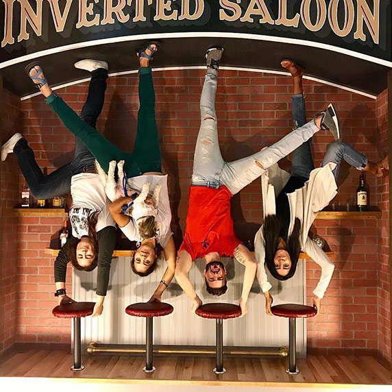 A novelty photo of apparently upside-down people at Inverted Experience in Seaside, Oregon