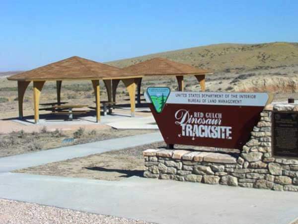 The sign for Red Gulch Dinosaur Tracksite in Greybull, Wyoming