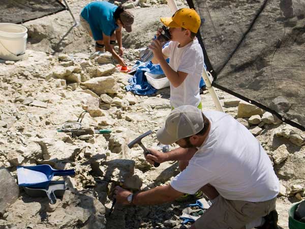 Visitors dig for dinosaur fossils at Wyoming Dinosaur Center in Thermopolis