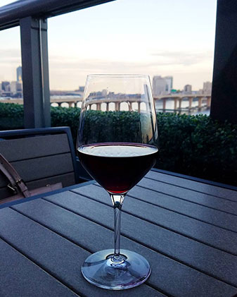 A glass of wine on a table in Jacksonville, FL
