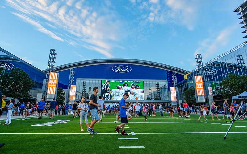Fans visit the Ford Center field at the Star in Frisco, Texas