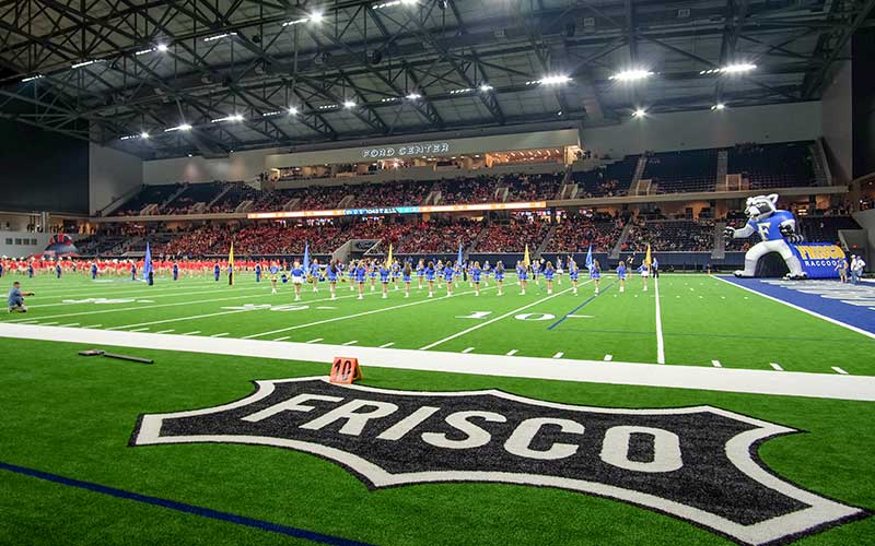 Cheerleaders on the field at the Ford Center at the Star in Frisco, Texas