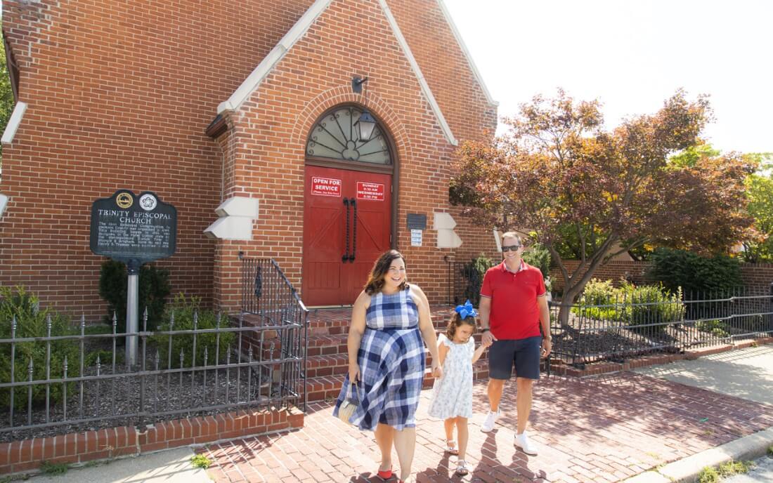 Influencer Jen Cowan and her family in front of the Trinity Episcopal Church in Independence, MO