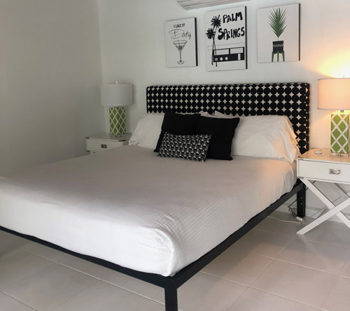 Black and white bed in Del Marcos Hotel room in Palm Springs, California
            