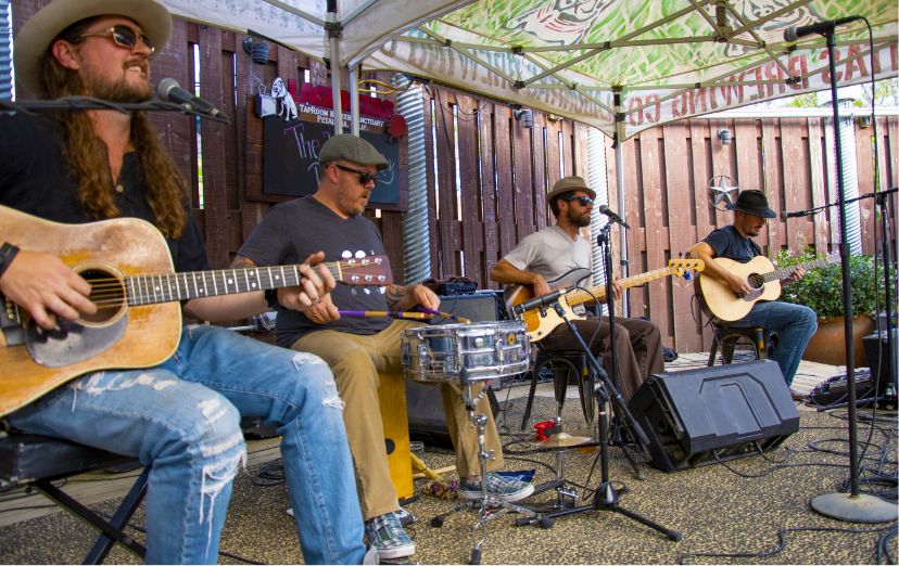 An acoustic band plays on the back porch of Lagunitas Brewing Company.