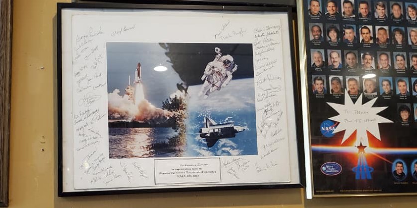 A signed photo from local astronauts at Frenchie’s Italian Restaurant in Bay Area Houston