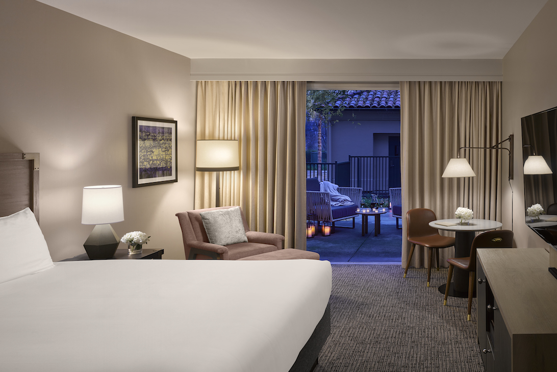 A beautiful hotel room with midcentury modern touches is one of the lodging options at the Flamingo Resort.