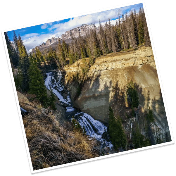 White water tumbles over granite cliffs at the Brooks Lake Creek Falls in Dubois, Wyoming.