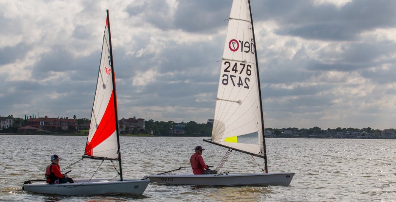 Two small sailboats race across the bay in Bay Area Houston