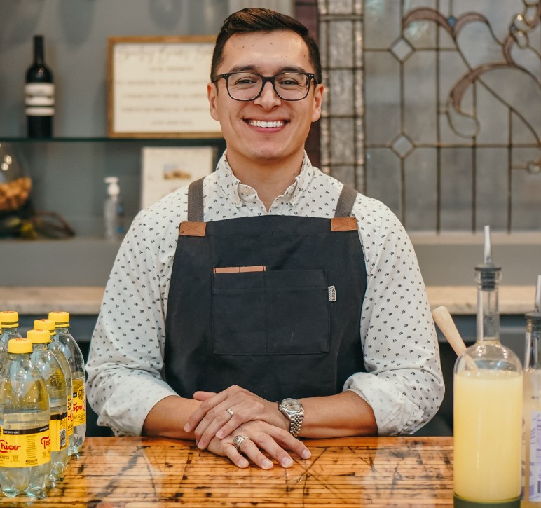 Daniel Hernandez standing behind his bar at The Embargo