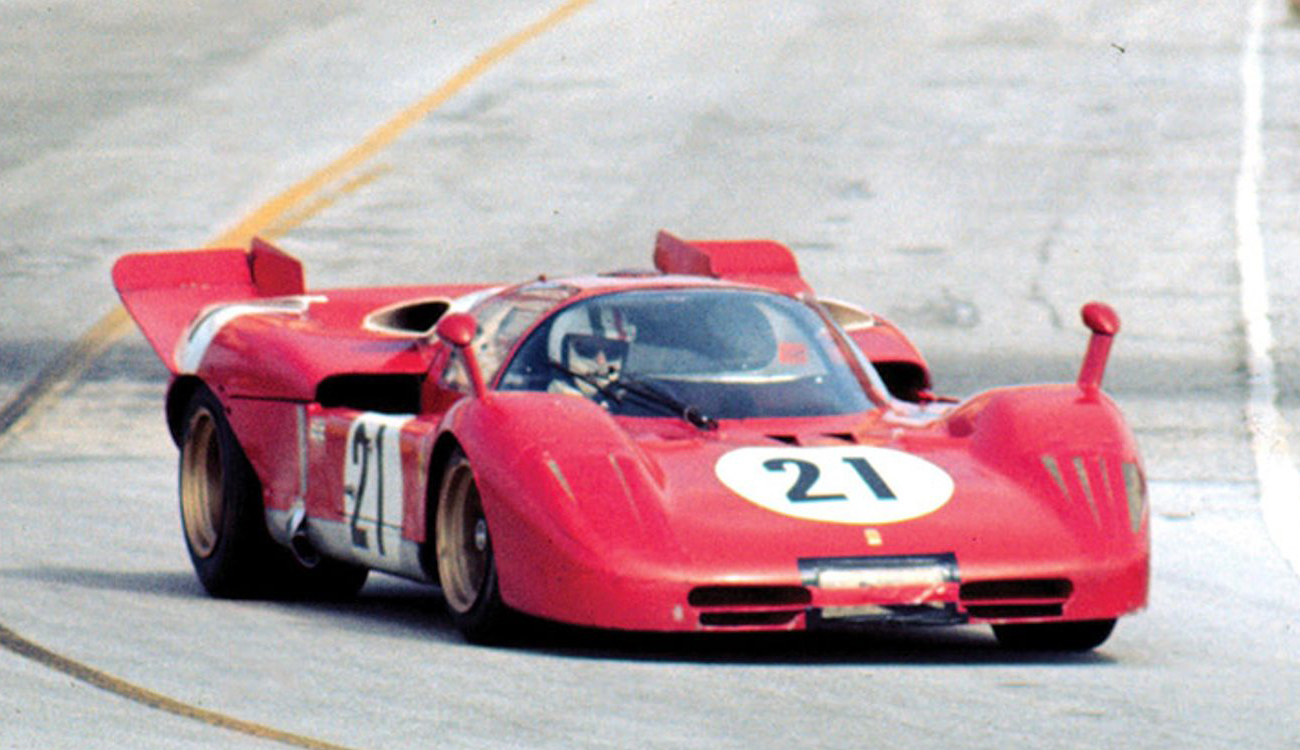 A red sportscare number 21 turns the corners at the Sebring International Raceway.