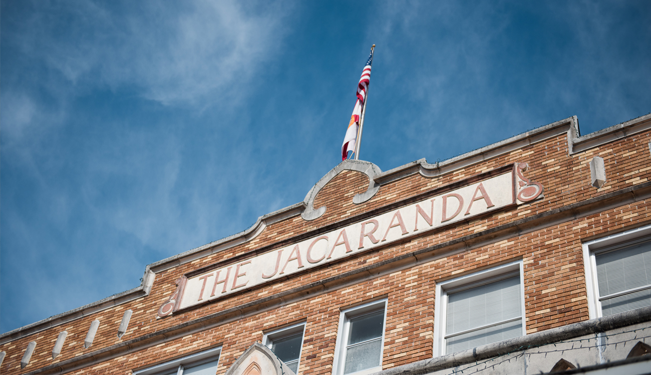 The historic sign of The Jacaranda resides high on the brick facade of The Jacaranda Hotel in Avon Park, Florida.