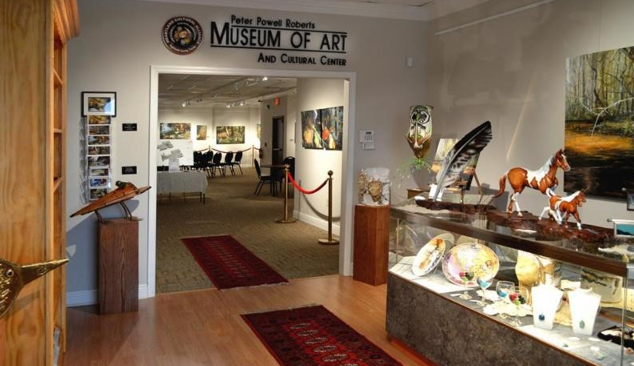 The entry way into the Peter Powell Roberts museum in Avon Park, Florida displays creative pieces of work on the walls and in display cabinets. 
